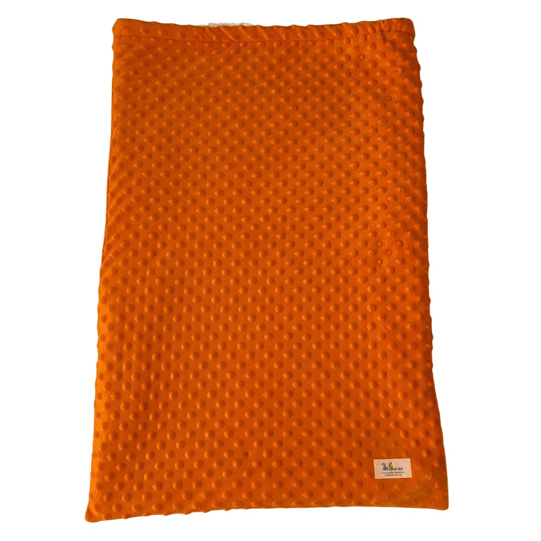 Vibrant orange pet sleeping bag laid flat as a mat for dogs or cats.