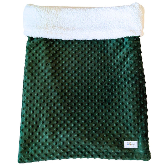 Emerald green faux Sherpa pet bed rolled up for travel or lounging